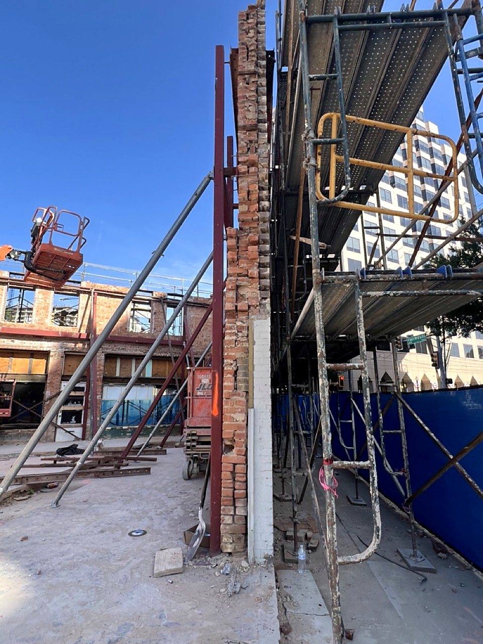 Steel shoring supporting a brick wall